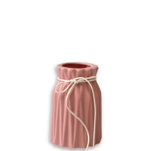 pink porcelain vase with white ribbon